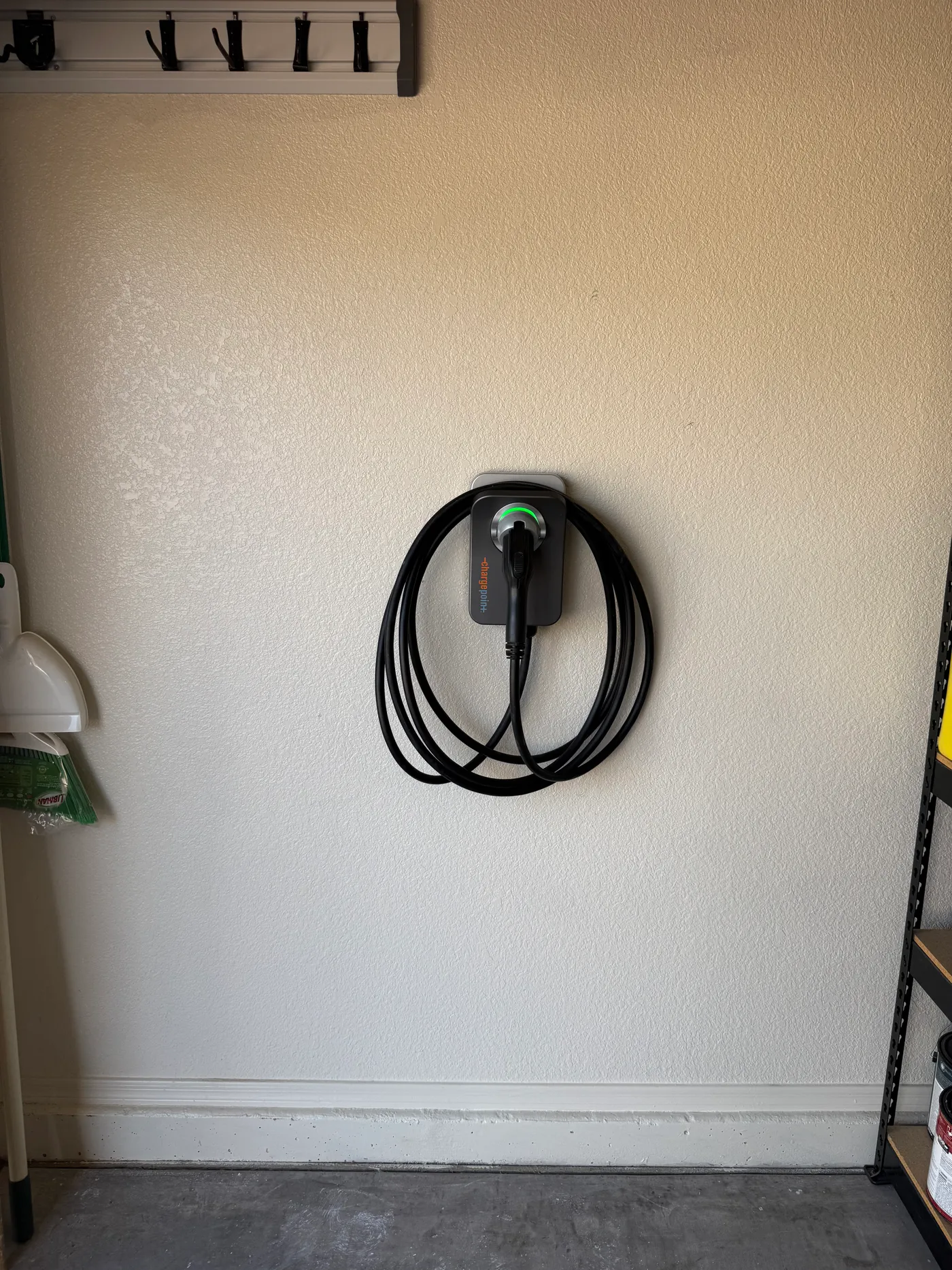 Wall-mounted ChargePoint Home Flex and its connection route.