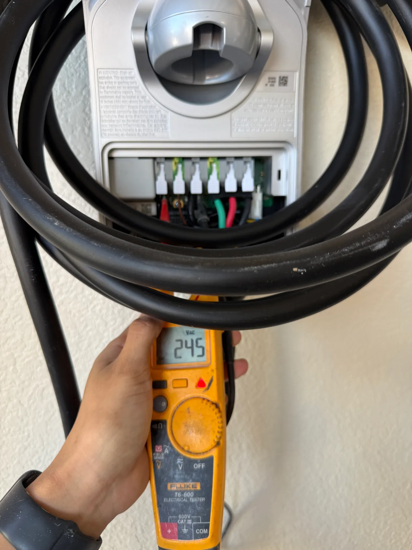 A digital meter during the voltage check shown in the project gallery.