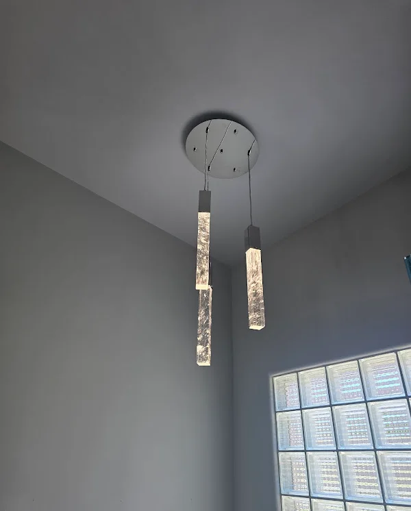 Installed three-pendant bathroom light fixture at Gina’s home