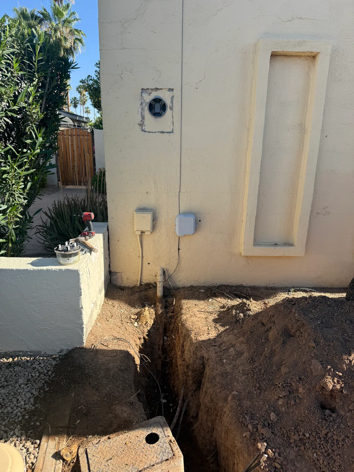 Excavation at the previous meter location during the service change.